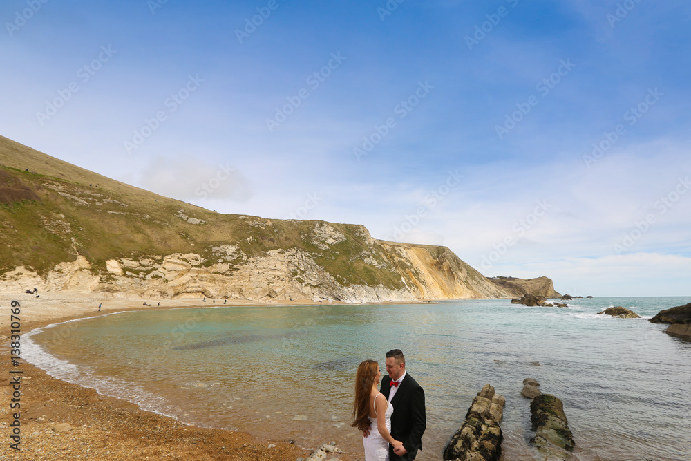 Groom and bride on the coast