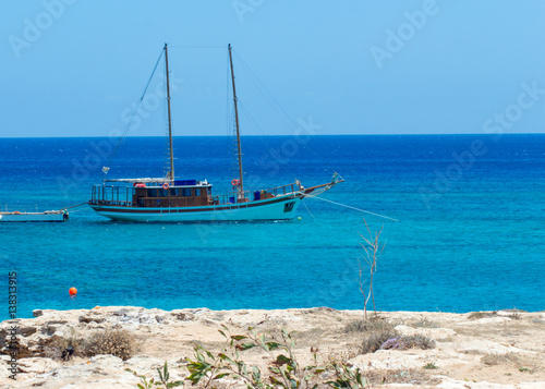 sailboat near a shore of mediterranien photo
