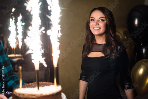 a birthday girl on her 18th birthday with baloons