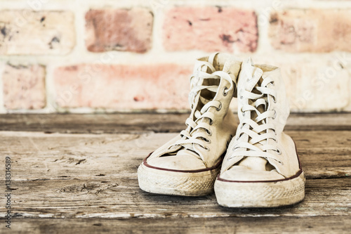 Old shoes on wooden background