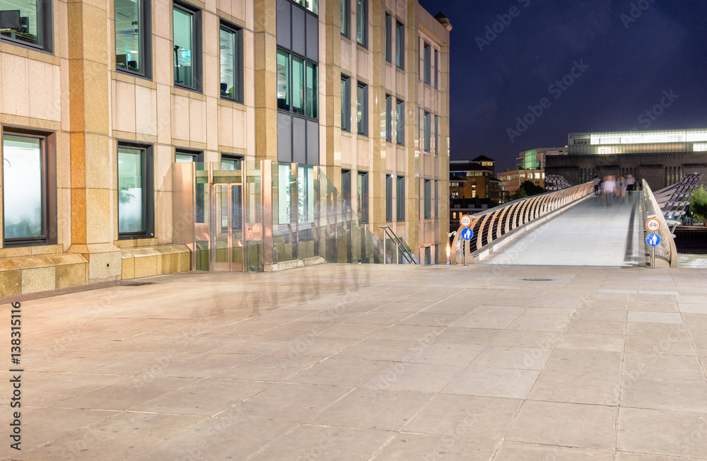 Millennium Bridge after sunset as see from northern side of Thames, London
