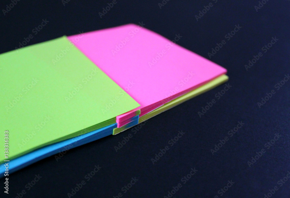the sticker intertwined reminds notes and other records on a dark background the sticker intertwined reminds notes and other records on a dark background