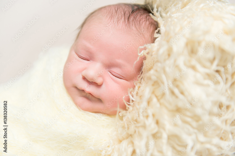 Hairy baby sleeping on yellow pillow, closeup Hairy baby sleeping on yellow pillow, closeup