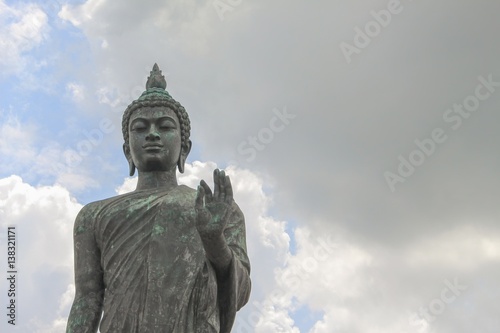 Big Buddha statue ancient on blue sky background in Nakhon Pathom Province of Thailand