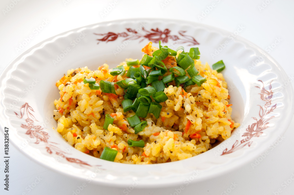 Plate of pilaf with green onions for lunch Plate of pilaf with green onions for lunch