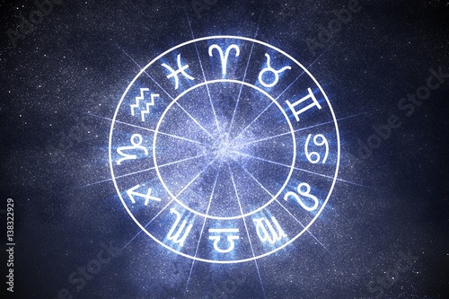 Astrology and horoscopes concept. Astrological zodiac signs in circle on starry background.