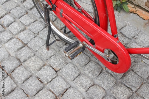 Red bicycle vintage antique in city photo