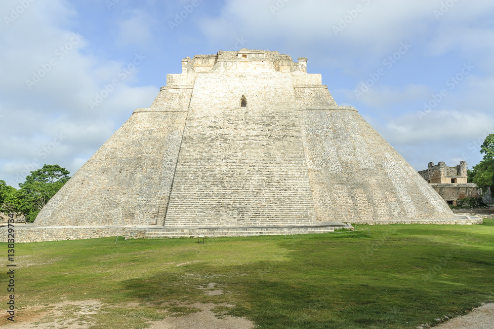 sight of the back of the pyramid of the magician in the Mayan archaeological Uxmal enclosure in Yucatan, Mexico.