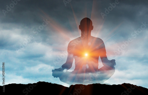 man practicing yoga outdoors photo