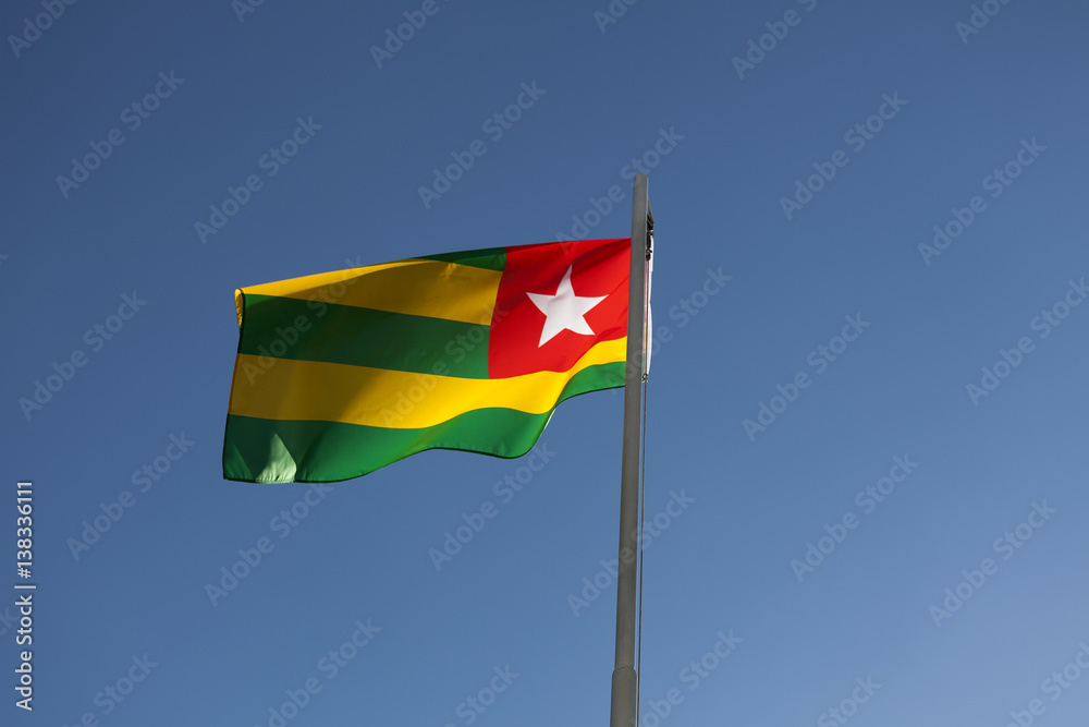 National flag of Togo on a flagpole National flag of Togo on a flagpole