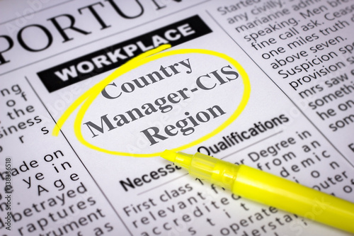 Country Manager-CIS Region - Newspaper sheet with ads and job search, circled with yellow marker, Blurred image and selective focus