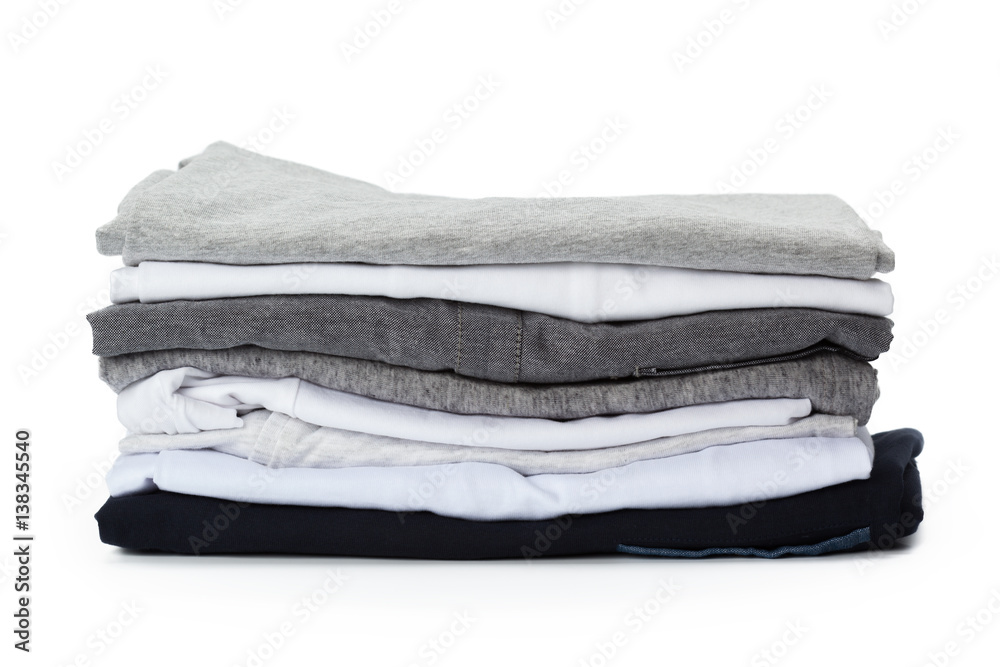 Stack of clothes on white background, closeup
