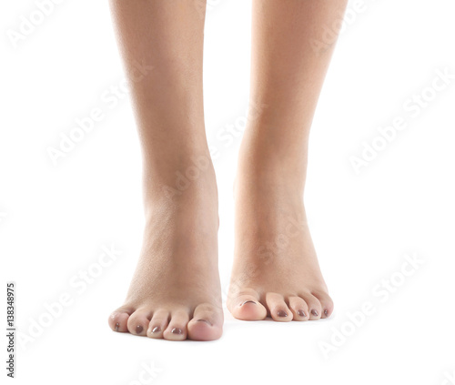 Female feet with brown pedicure isolated on white
