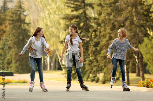 Teenager girls on roller skates in park