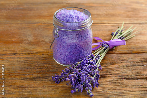 Sea salt with lavender on wooden background