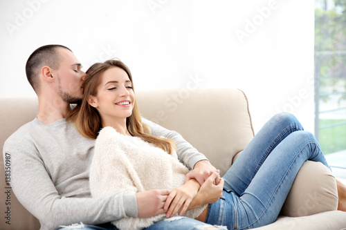 Young couple sitting together