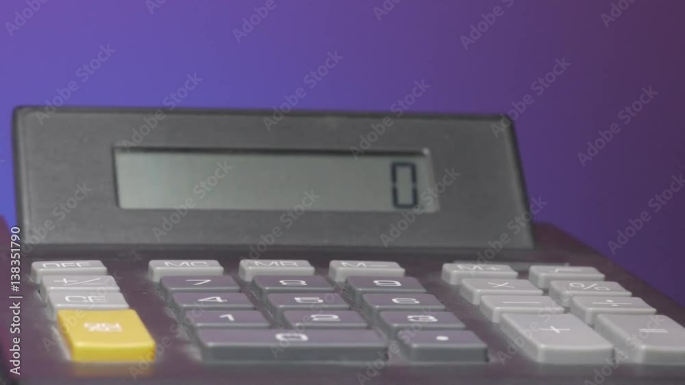 Electronic calculator rotating on a table. Electronic calculator rotating on a table.