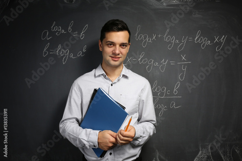 Handsome young teacher with...