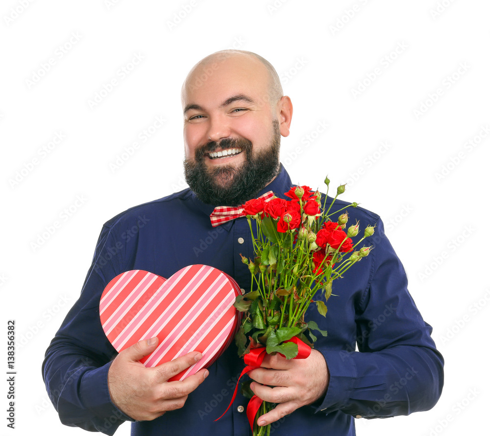 Funny fat man with bouquet of flowers and giftbox on white background