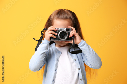 Little girl with vintage ca...