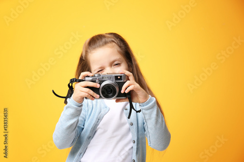 Little girl with vintage ca...