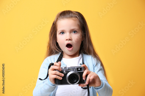 Little girl with vintage ca...