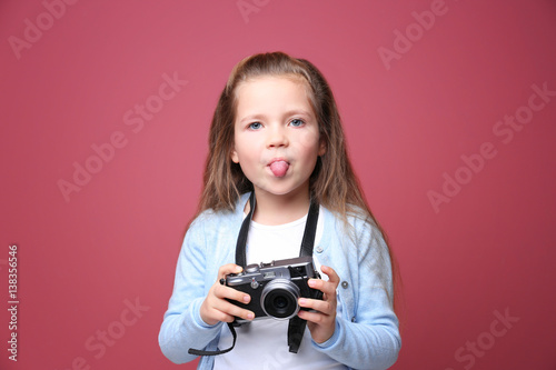 Little girl with vintage ca...