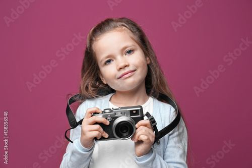 Little girl with vintage ca...