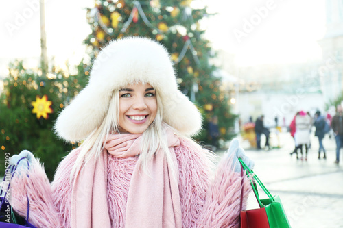 Woman with shopping bags on...
