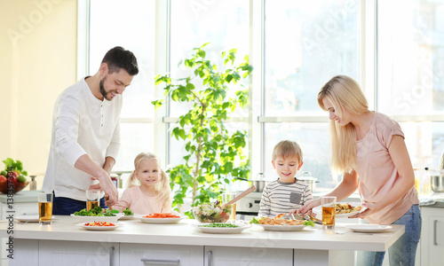 Happy family having breakfa...