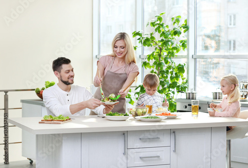 Happy family having breakfa...