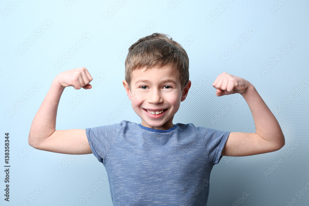 Portrait of little boy on light blue background Portrait of little boy on light blue background