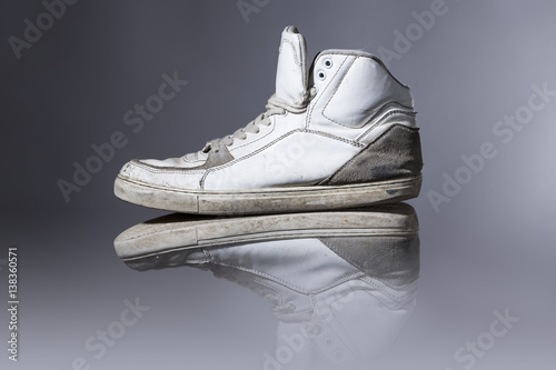 old white sneakers with gray background