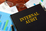 Book with title Internal Audit on a table.