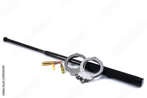 Image of Police Batton, handcuffs, and bullets photo