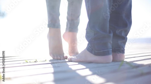 Woman on tiptoes kissing partner