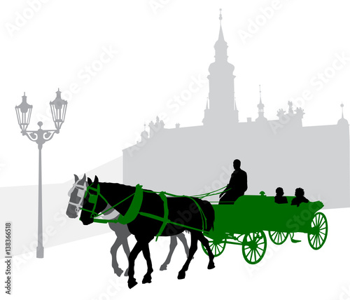 Silhouette of a carriage with tourists in Prague against Loretta