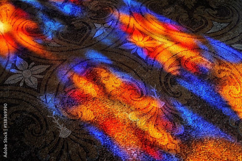 Colorful light spots on the stone mosaic floor.