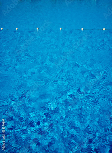Blue water in the swimming pool, safety buoys