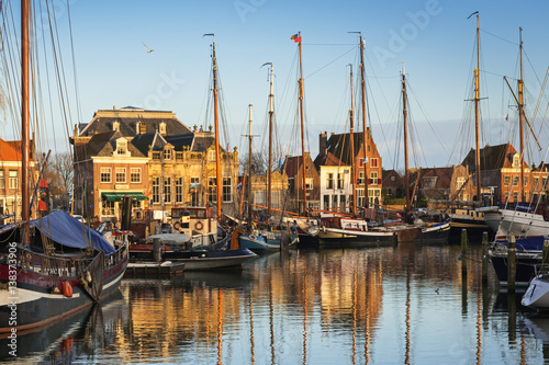  View of the historical part of the city and Oude harbor from the bridge at the evening, Netherlands