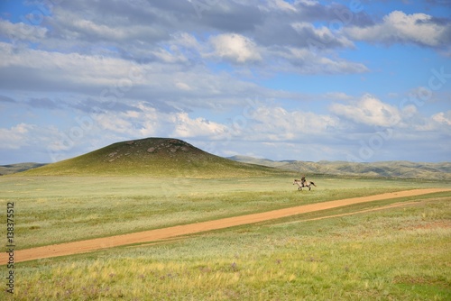 Lonely horseman in Kazakhstan steppe