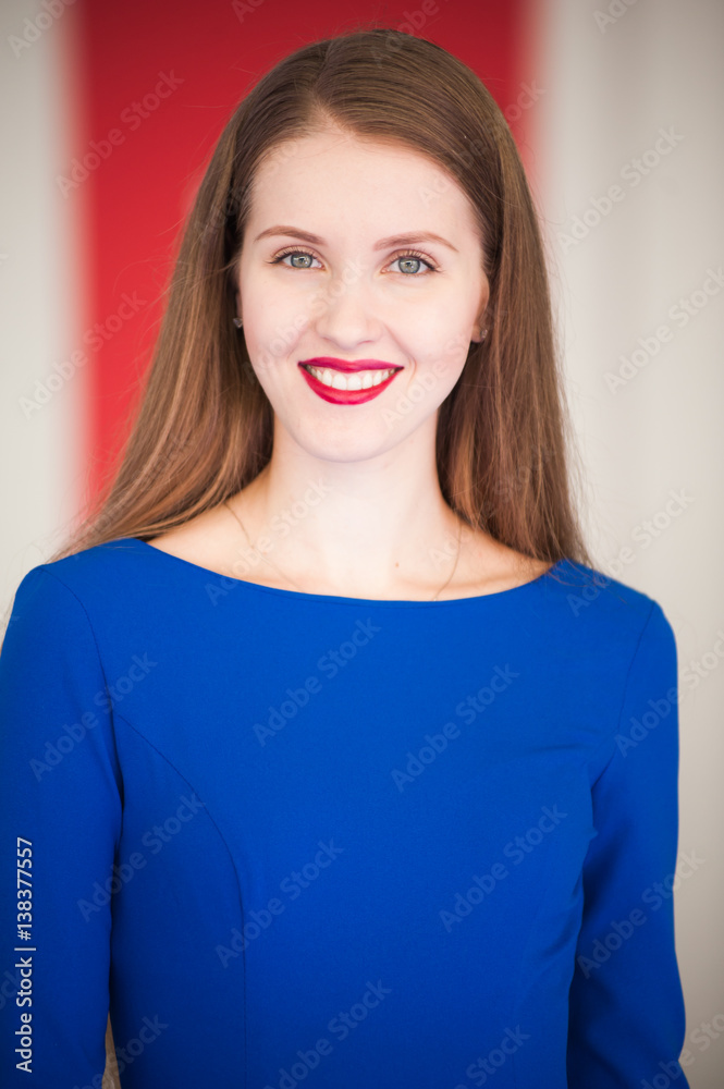 portrait of beautiful woman in blue dress