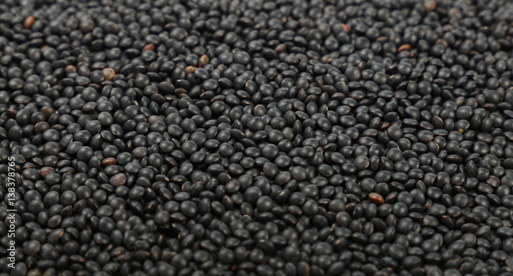 Black Beluga lentil lens close up background Black Beluga lentil lens close up background