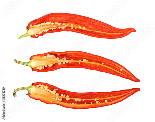 Three cut hot chili peppers isolated on white