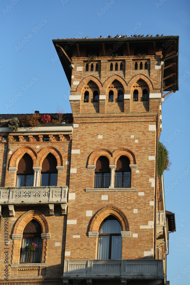 antique brick building with a little tower