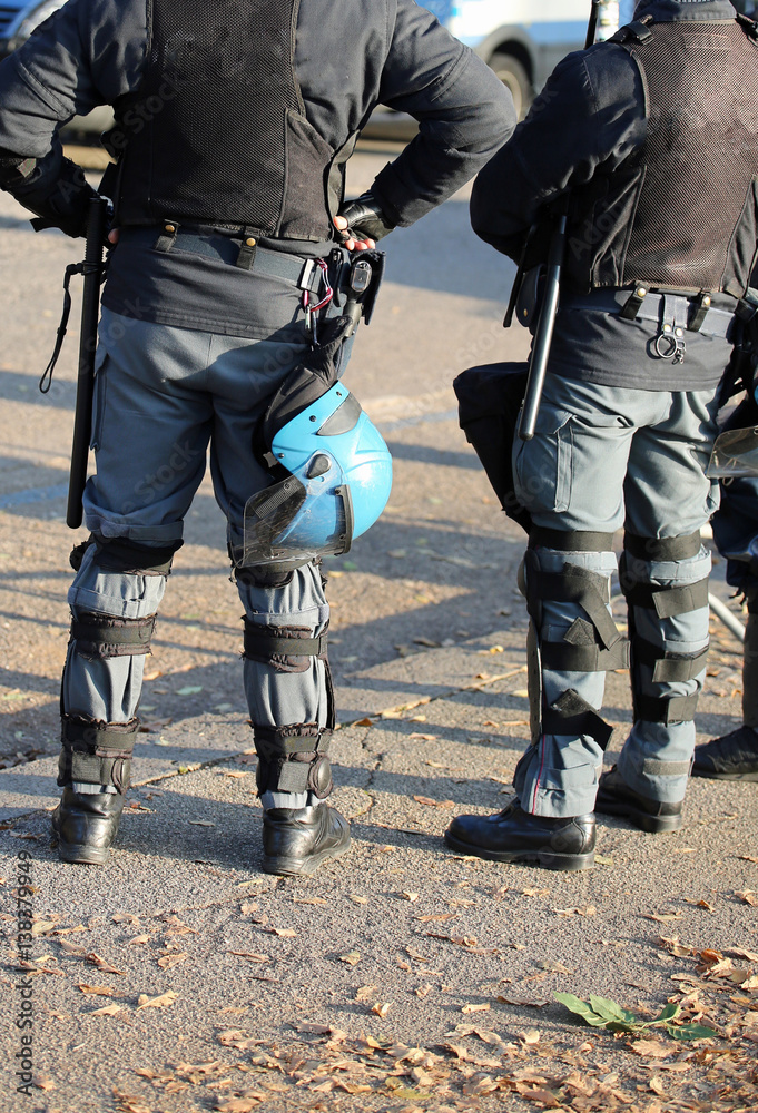 police in riot gear with protective helmet waiting for the fans police in riot gear with protective helmet waiting for the fans
