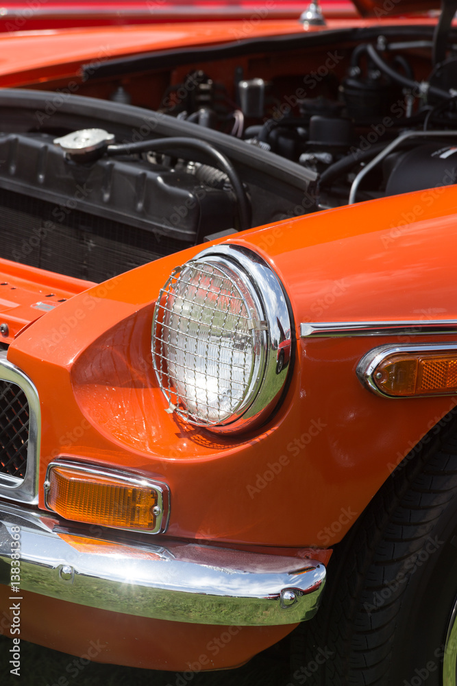 Headlight of a Orange Vintage Car