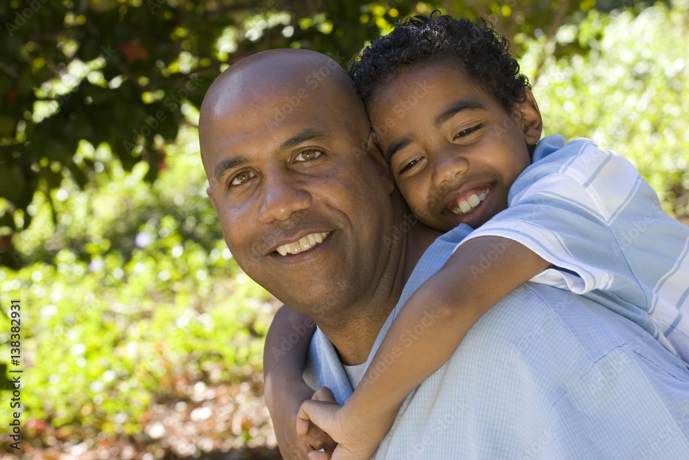 African American father and son spending time together. African American father and son spending time together.