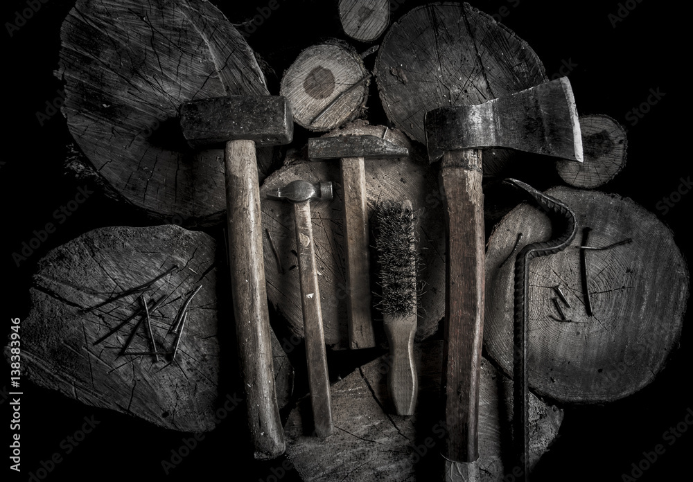 Φωτογραφία Axe, pinch-bar, brush and set of hammers with wooden handles on the wooden stub