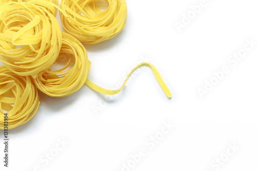 Italian fettuccine pasta isolated on white background